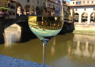 A Glass of Wine Facing the Old Bridge in Florence